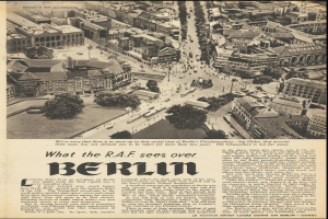 Schwarz-weißes Bild einer alten Zeitung mit einem Stadtpanorama-Foto, das Gebäude, Bäume und Fahrzeuge zeigt, begleitet von Text.
