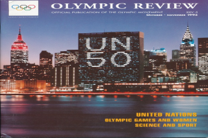 Ein Buch mit dem Titel "Olympic Review Official Publication of the Olympic Movement" liegt auf einer flachen Oberfläche, das eine Stadtlandschaft mit Gebäuden, Lichtern und Wasser auf dem Cover zeigt, mit dem Text "United Nations Olympic Games and Women Science and Sport" ebenfalls sichtbar.