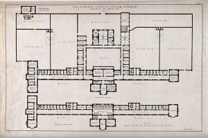 Schwarz-weißer Architekturplan eines Gebäudegeschosses mit zahlreichen beschrifteten Räumen, darunter ein als Irrenhaus für Kriminelle ausgewiesener Bereich, sowie handschriftliche Anmerkungen.